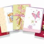 Three pastel greeting cards with butterfly and floral designs