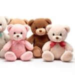 Assorted plush teddy bears in pink, brown, and cream with bows