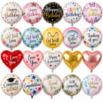 Assorted round and heart-shaped birthday and occasion balloons with printed messages