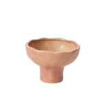 Speckled ceramic pedestal bowl on a white background