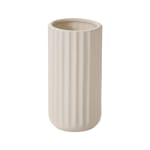 Beige ribbed ceramic vase on a white background