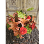 Bouquet of peach lilies, red roses, and green anthuriums