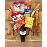 Snack bouquet in a black tumbler with chips, candy, jerky, and peanuts