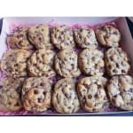 Box of chocolate chip cookies on pink paper filler