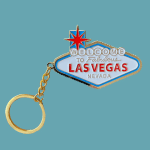 Las Vegas souvenir keychain with a gold ring and enamel sign charm