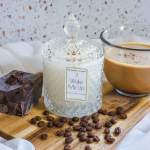 Coffee-scented candle jar with a cup of coffee and chocolate pieces