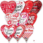 Cluster of heart-shaped red and white balloons with love messages