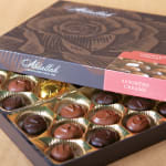 Box of assorted chocolates in gold paper cups