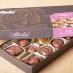 Box of assorted milk chocolates in gold paper cups