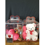 Two boxed teddy bears with heart pillows and a Valentine card