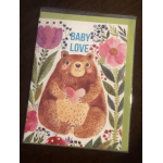 Baby love card with a bear holding a heart and floral border
