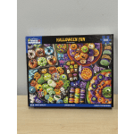 Halloween-themed jigsaw puzzle box with colorful spooky treats and characters