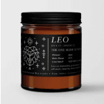 Amber candle jar with a black label and Leo zodiac design