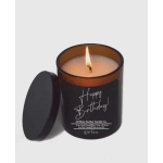 Lit birthday candle in a black glass jar with lid