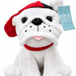 Plush bulldog wearing a red Santa hat and collar