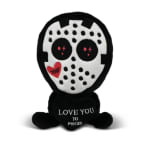 Plush skull character holding a heart with text