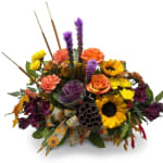 Autumn bouquet with sunflowers, roses, carnations, and purple flowers