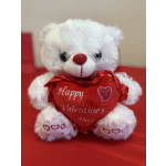 White teddy bear holding a red heart with Valentine's text