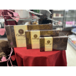 Boxes of assorted chocolates displayed on a red cloth