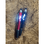 Two mermaid-themed pens on a straw-like background