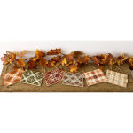 Fall-themed plaid signs with autumn leaves on a wooden board