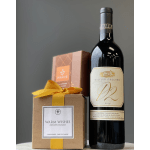 Gift set with a candle box and a bottle of red wine
