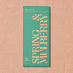 Green chocolate bar package on a pink textured background