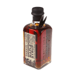 Bottle of maple syrup with a dark cap and amber liquid