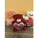 Three plush teddy bears holding heart-shaped Valentine signs