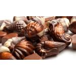 Assorted chocolate truffles and pralines piled together