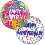 Two anniversary balloons with colorful confetti patterns