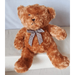Brown teddy bear with a checkered ribbon bow