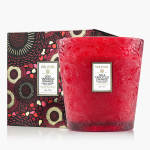 Red patterned candle in a decorative box