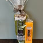 Gift bag with sausage and cheddar wrapped in clear cellophane