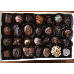 Assorted box of dark and milk chocolates in a white tray