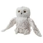 White plush owl toy with outstretched wings on a plain white background