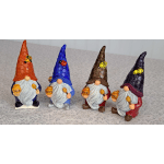 Set of four colorful gnome figurines holding honey pots with bees and a ladybug on their tall textured hats.