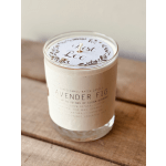 Lavender fig candle in a clear glass jar with a white label