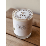 Spiced pumpkin candle in a glass jar with a printed lid