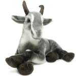 Plush goat toy sitting on a white background