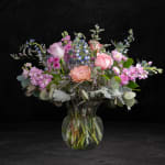 Mixed pink and lavender bouquet in a clear glass vase