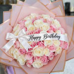 Pink and white rose bouquet with a Happy Birthday ribbon