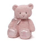 Pink teddy bear with a satin bow and embroidered feet
