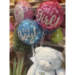 Baby shower balloons with a teddy bear in front