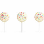 Three white cake pops with colorful sprinkles on sticks