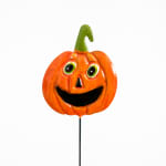Smiling orange pumpkin decoration on a stick