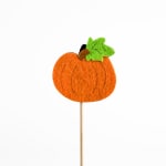 Orange felt pumpkin on a wooden stick