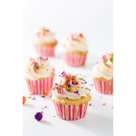 Vanilla cupcakes with white frosting and rainbow sprinkles in pink striped liners