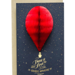 Red paper hot air balloon card with gold stars and lettering