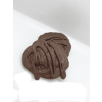 Pile of melted chocolate on a white surface